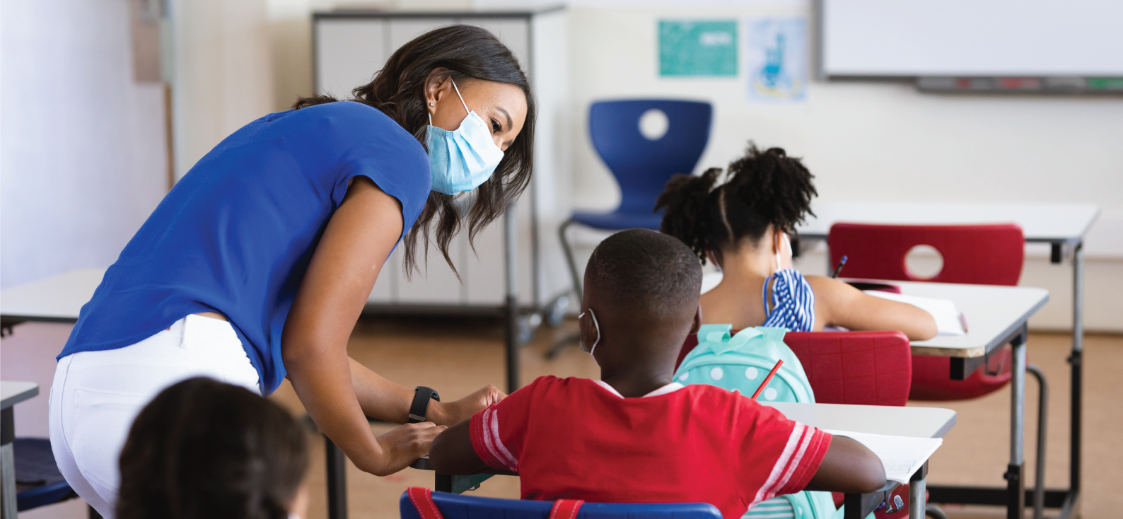 Teacher helping student