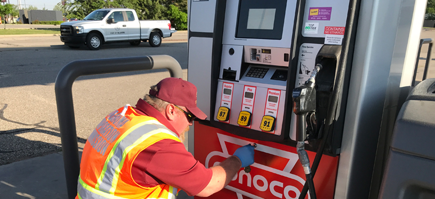 Inspector opening fuel dispenser