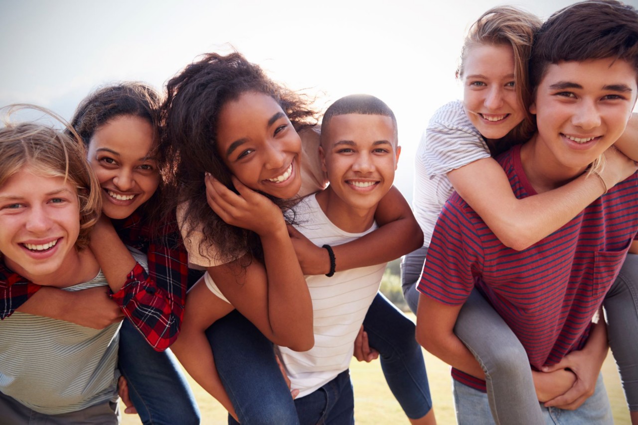 A group of teens enjoys time together. 