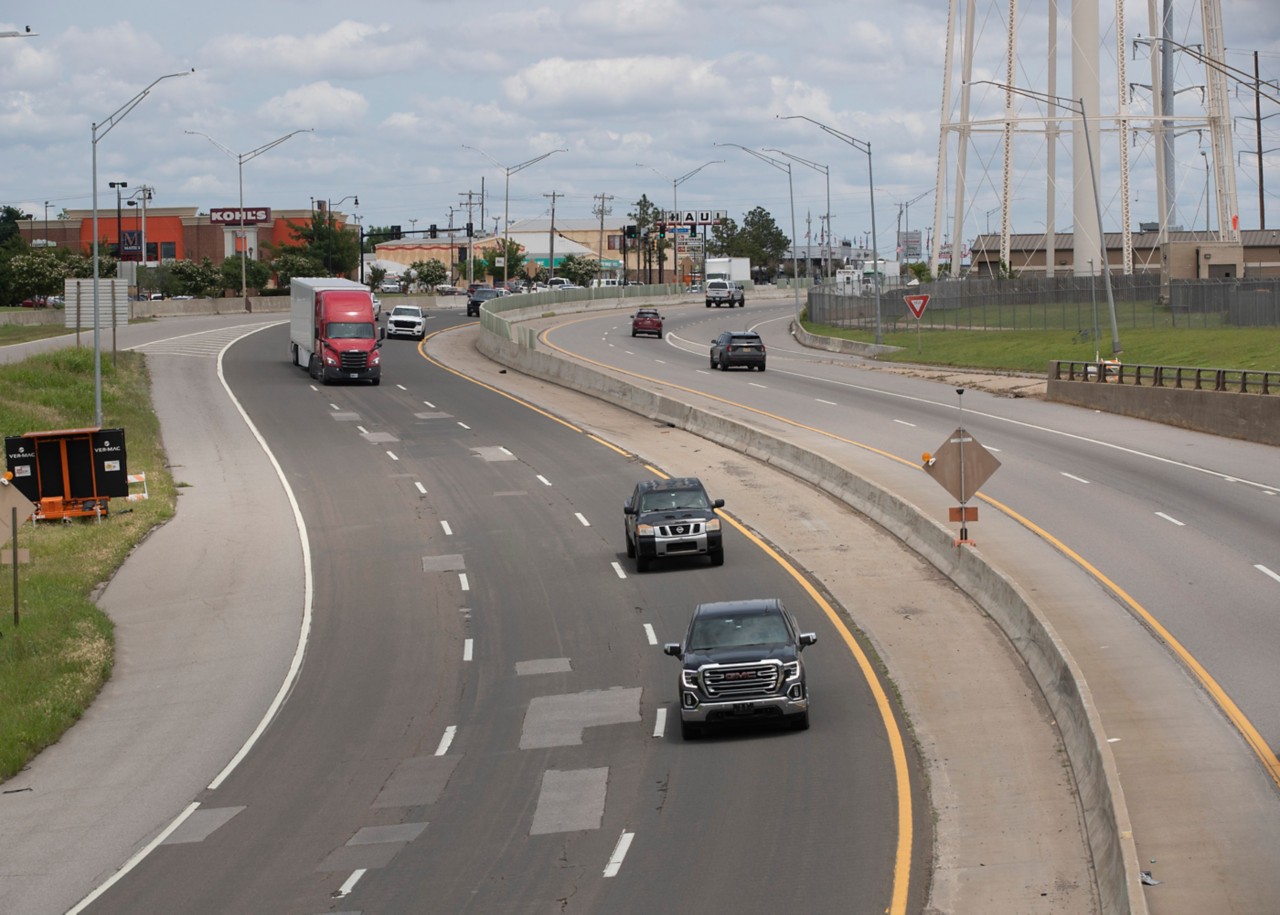 I-40 near Tinker Air Force Base in Midwest City with cars and trucks driving on rough pavement