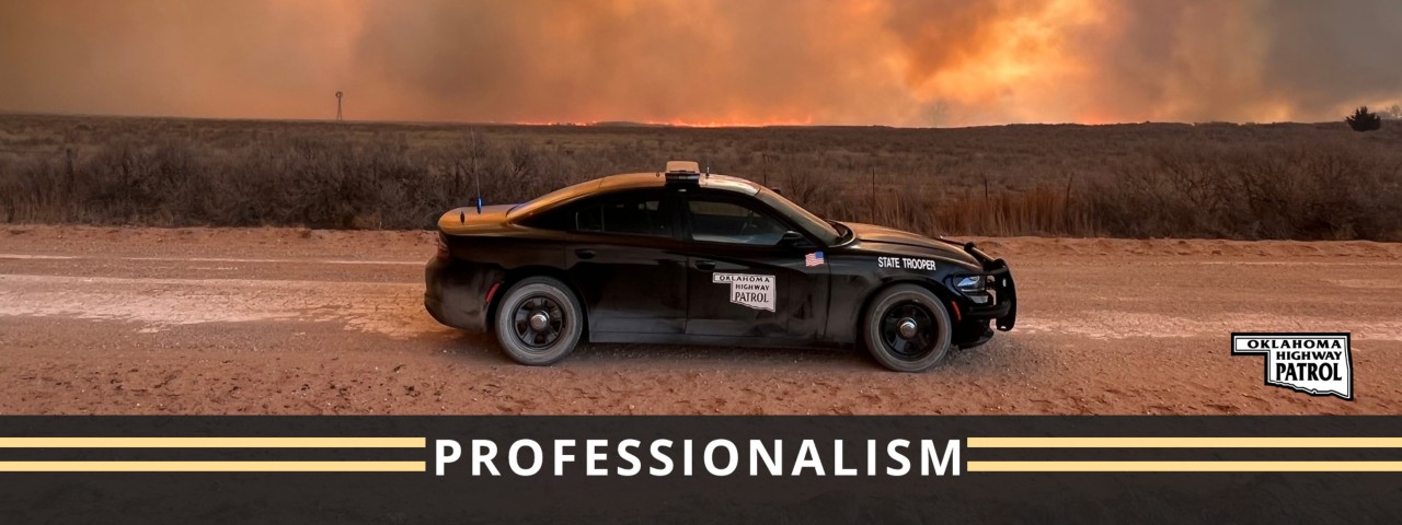 OHP car on dirt road in sunset