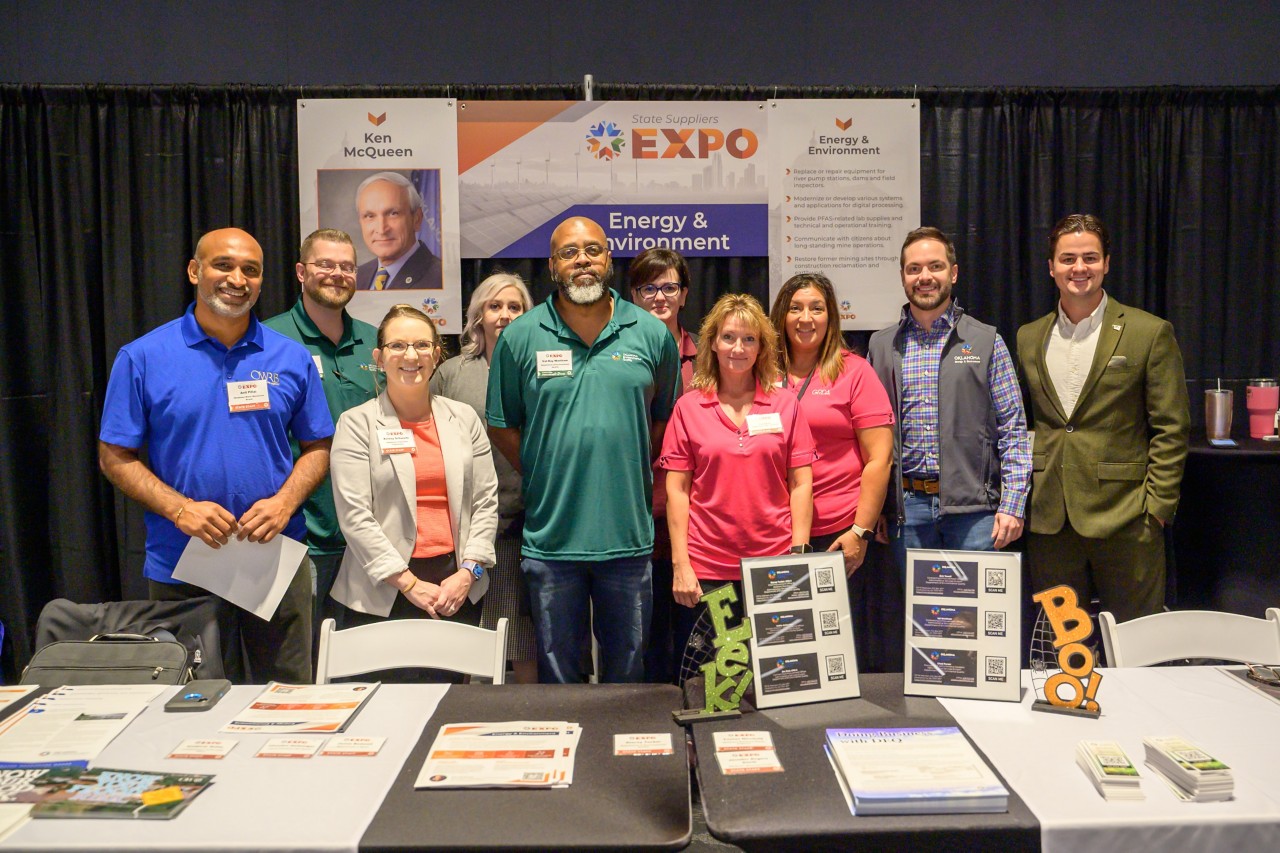 Energy and Environment cabinet staff smiling at their booth.