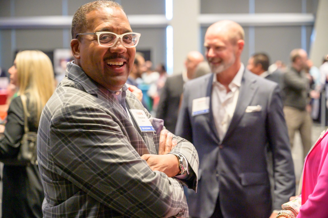 Attendee smiling at camera.