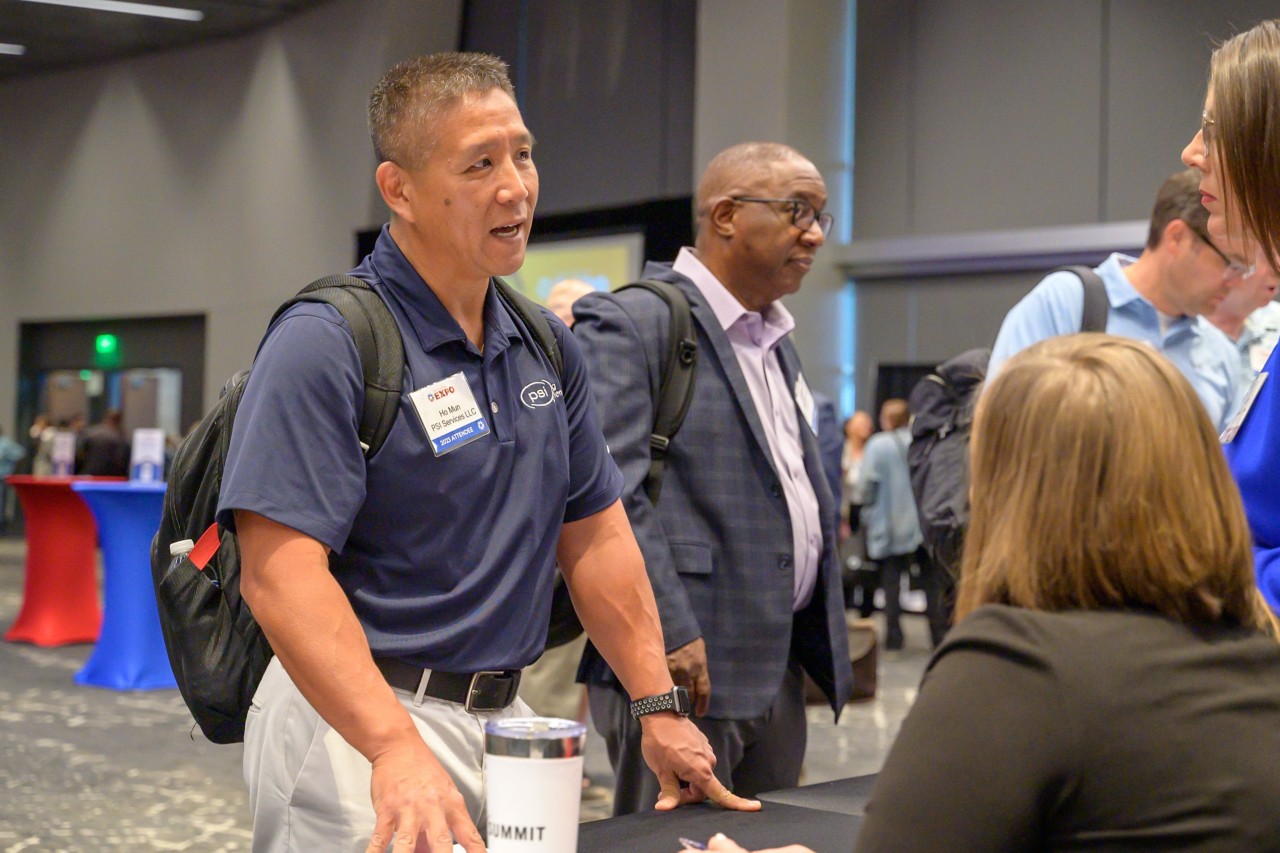 Attendee from PSI Services LLC talking to Public Safety cabinet staff.