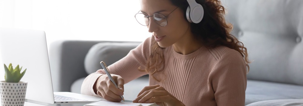 Employee learning online with headphones